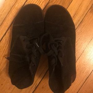 All Black suede Toms high-top shoes
